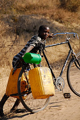 Youth transporting water by bicycle.  (copyright Tobi Bruce 2009)