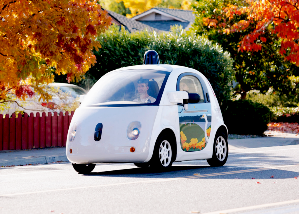 Google Driverless Concept Car on the street with passenge.